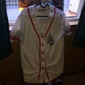 White jersey A couple of brown stains but could be fixed with bleach.